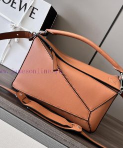Loewe Bags Loewe's New Embossed Logo Medium Puzzle Handbag Has ArrivedLOEWE's Debut Handbag Features A Rec uofoabbn